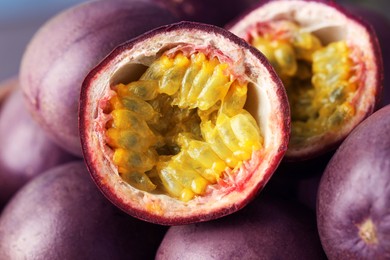 Photo of Many fresh passion fruits as background, closeup