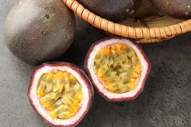 Photo of Fresh passion fruits on grey table, flat lay