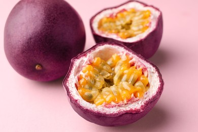Photo of Fresh passion fruits on pink background, closeup