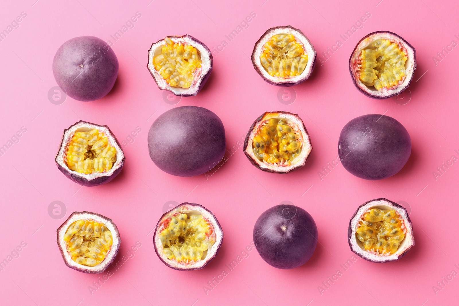Fresh passion fruits on pink background, flat lay Photo of Fresh passion fruits on pink background, flat lay
