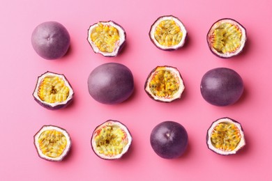 Photo of Fresh passion fruits on pink background, flat lay