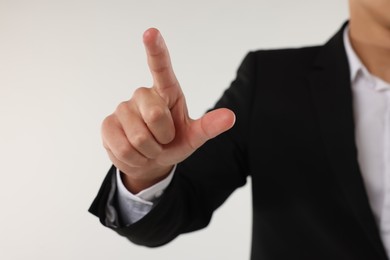 Photo of Man touching something on white background, closeup