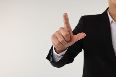 Photo of Man touching something on white background, closeup. Space for text