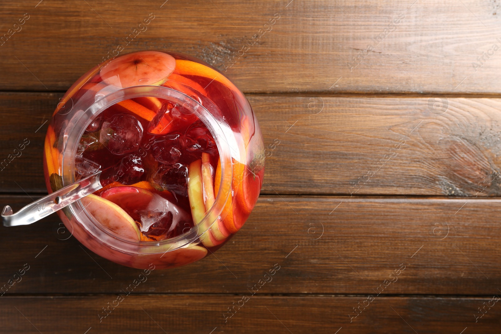 Tasty fruity punch on wooden table, top view with space for text. Refreshing drink Photo of Tasty fruity punch on wooden table, top view with space for text. Refreshing drink