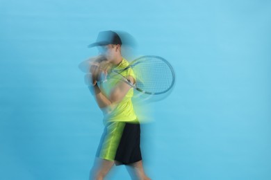 Photo of Man with racket playing tennis on light blue background, motion blur effect