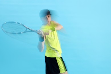 Photo of Man with racket playing tennis on light blue background, motion blur effect
