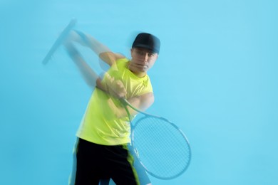 Photo of Man with racket playing tennis on light blue background, motion blur effect