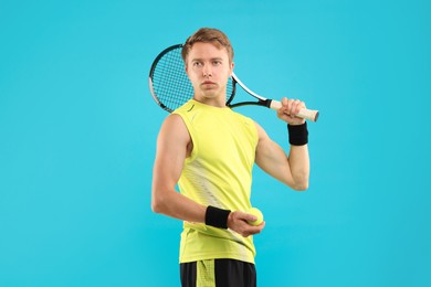 Photo of Man with tennis racket on light blue background