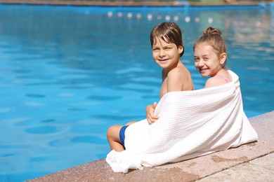 Photo of Little kids at poolside outdoors on sunny day, space for text. Family vacation