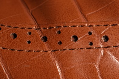 Photo of Texture of natural leather as background, closeup