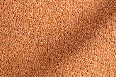 Photo of Texture of natural leather as background, top view