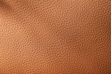 Photo of Texture of natural leather as background, top view