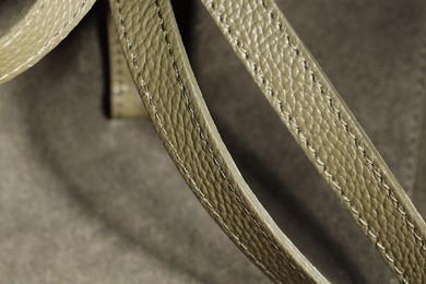 Photo of Olive leather bag as background, closeup view