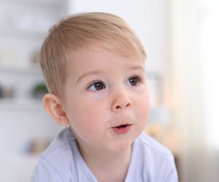 Photo of Portrait of cute little baby at home