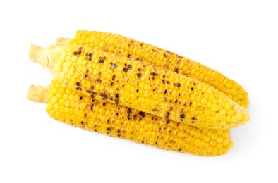 Photo of Three tasty grilled corncobs isolated on white, top view