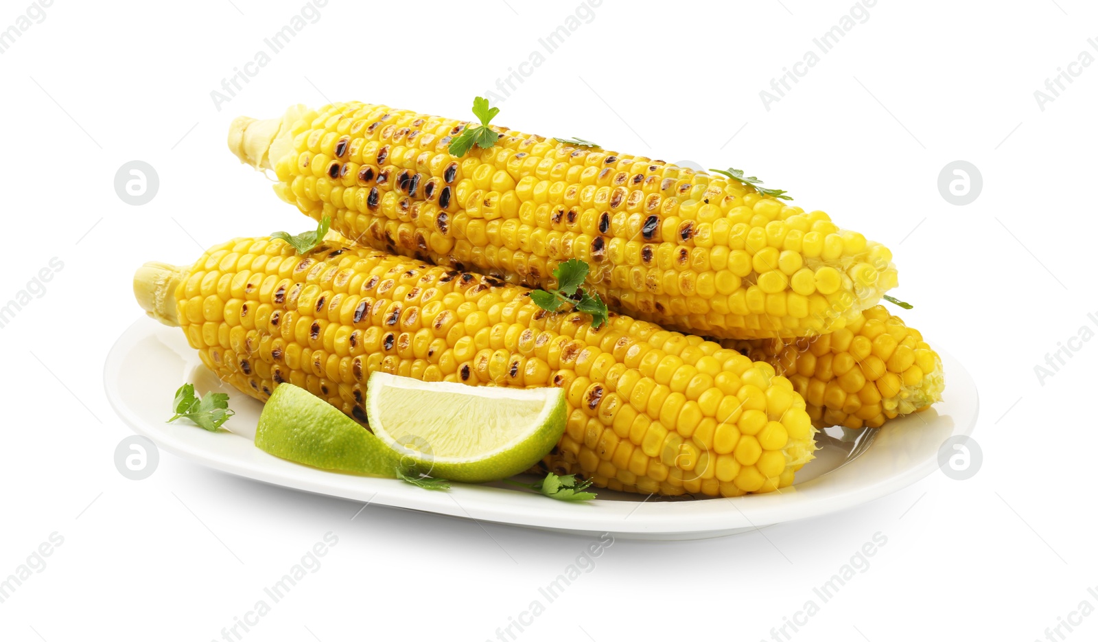 Photo of Tasty grilled corncobs with parsley and lime slices isolated on white