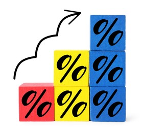 Image of Percent signs on colorful cubes and arrow against white background
