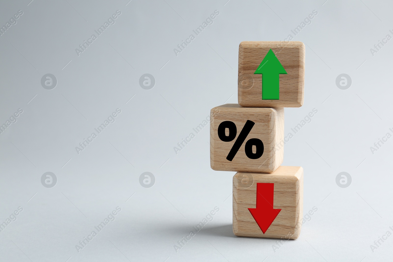 Cubes with percent sign, up and down arrows against grey background. Space for text Image of Cubes with percent sign, up and down arrows against grey background. Space for text