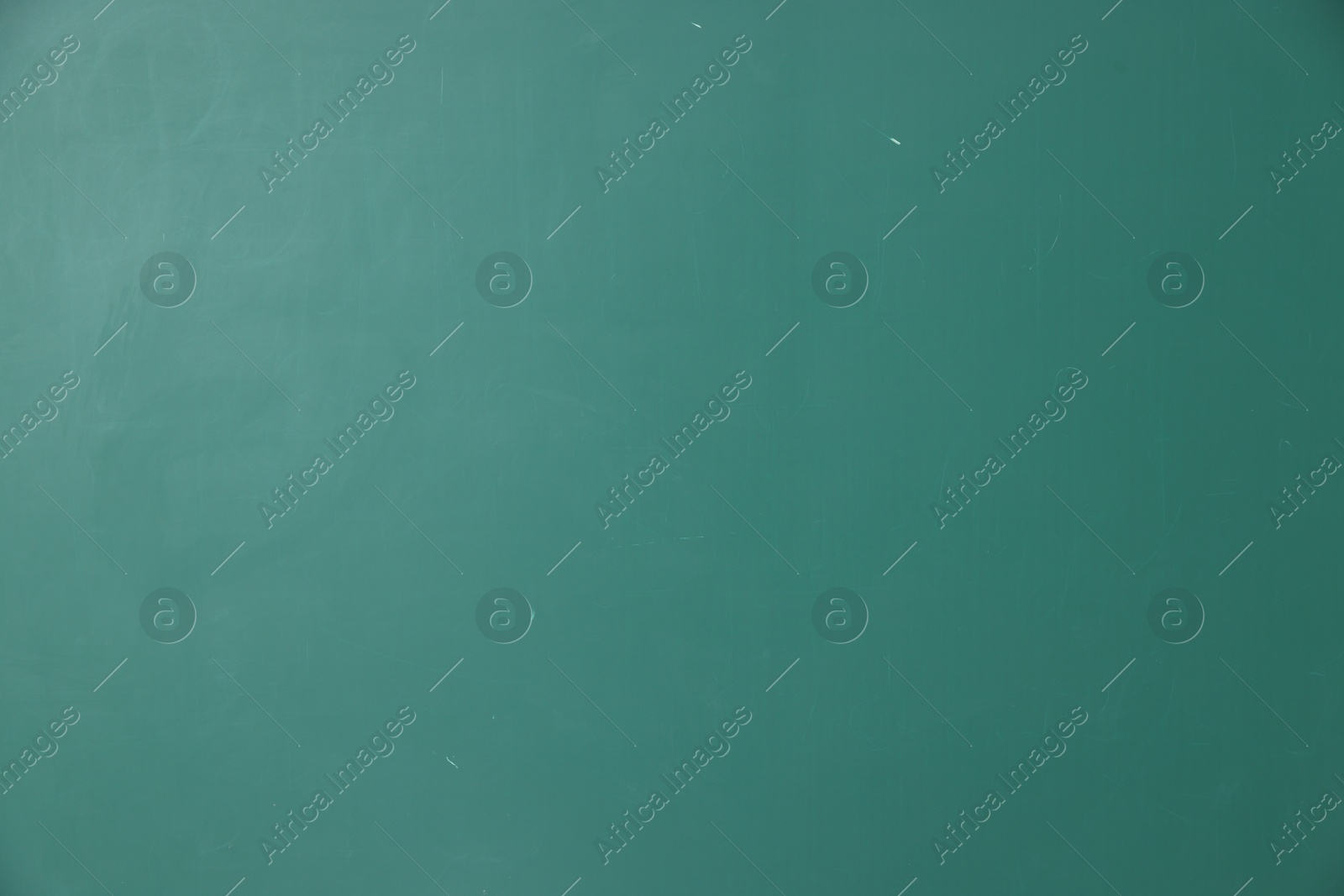 Photo of Blank green chalkboard as background, closeup view