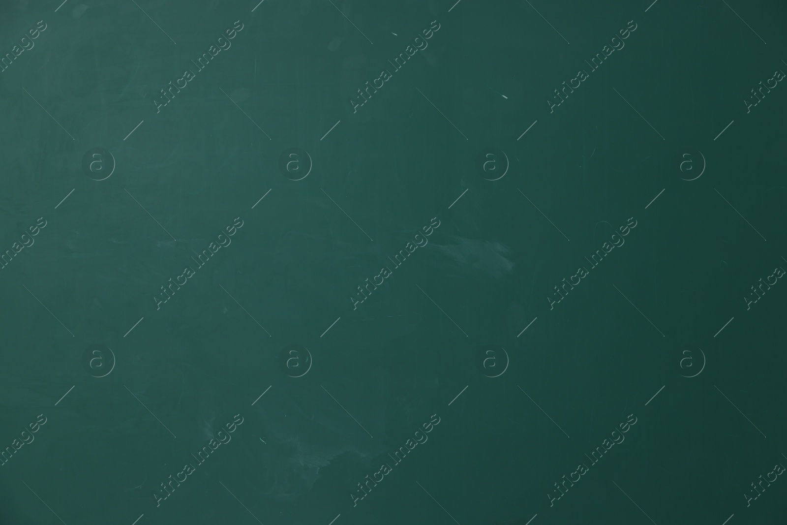 Photo of Blank green chalkboard as background, closeup view