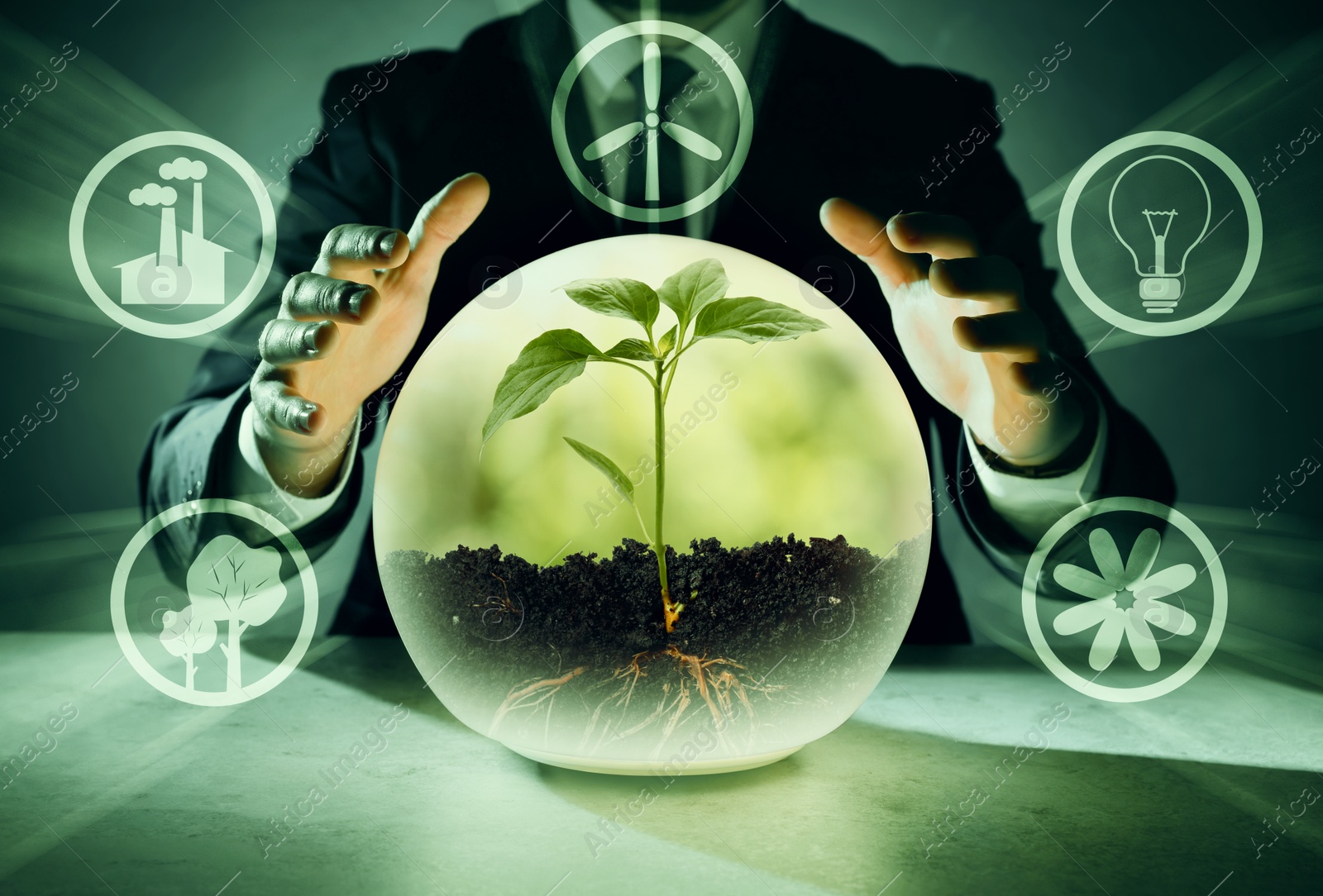 Electricity and nature. Businessman and crystal ball with green plant at table, closeup. Different icons around Image of Electricity and nature. Businessman and crystal ball with green plant at table, closeup. Different icons around