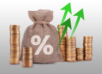 Image of Burlap bag with percent sign, arrows and stacked coins on grey gradient background