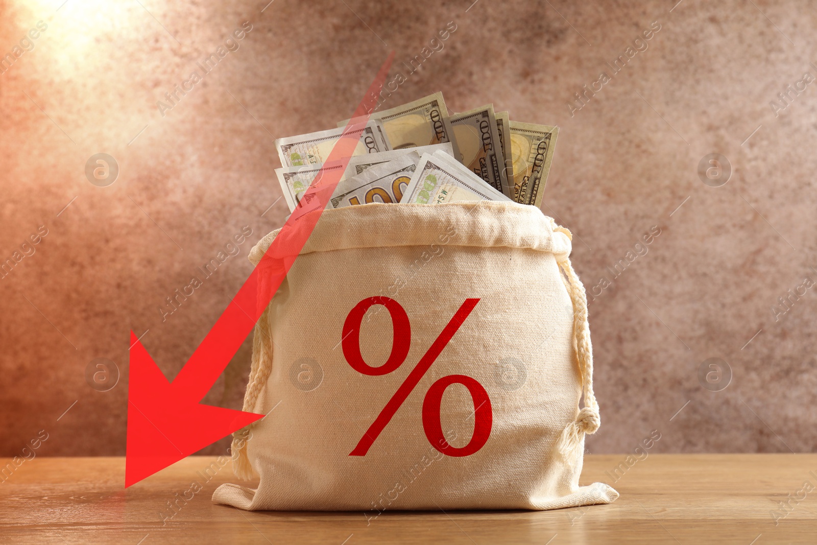 Burlap bag with percent sign full of money and arrow against brown textured background Image of Burlap bag with percent sign full of money and arrow against brown textured background