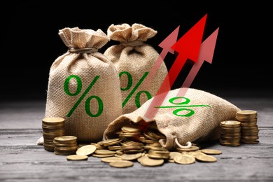 Image of Burlap bags with percent signs, arrows and coins against black background