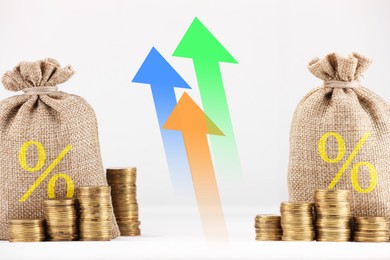 Image of Burlap bags with percent signs, arrows and coins against white background