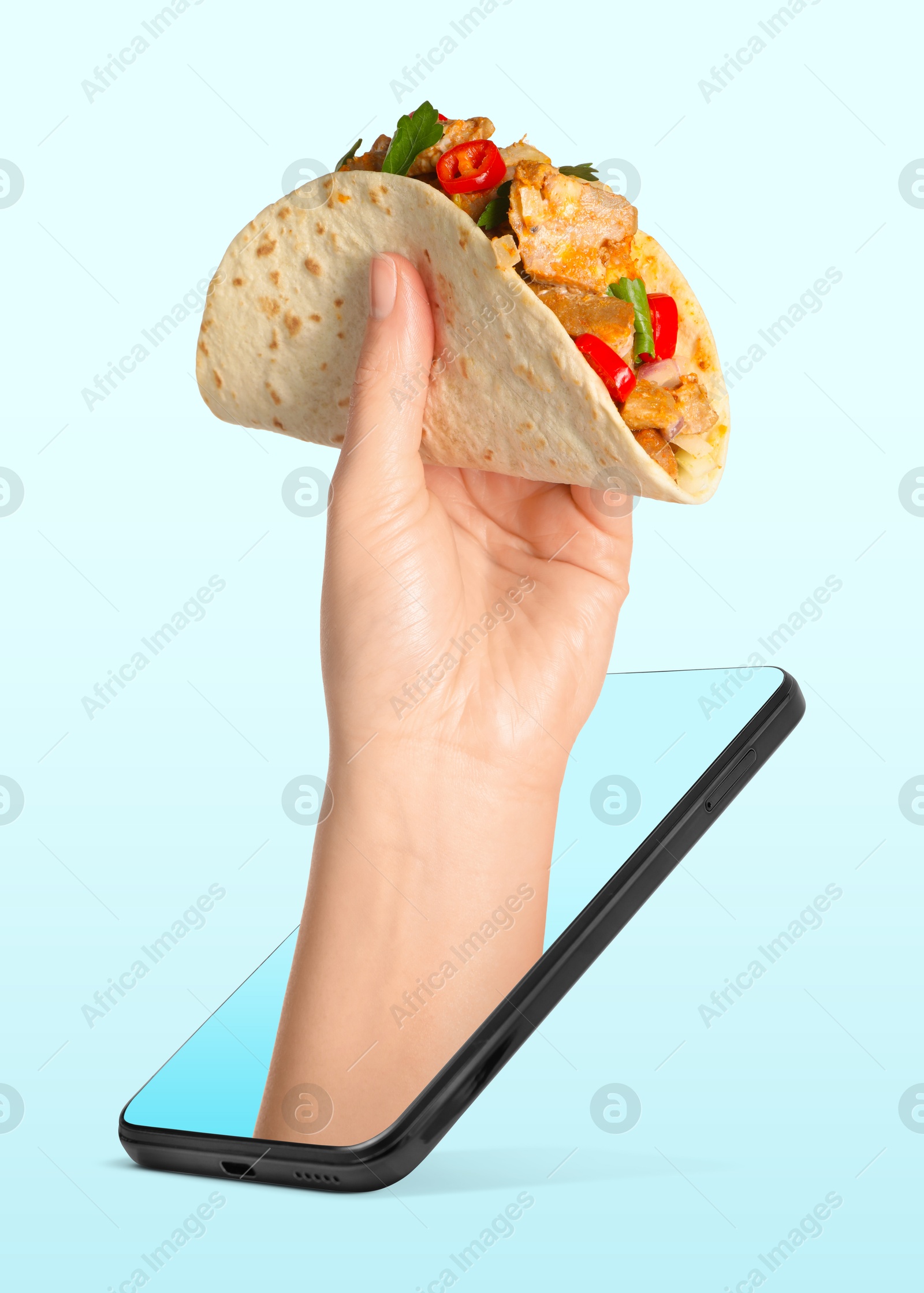 Image of Food ordering and delivery service. Woman's hand with tasty taco, sticking out of mobile phone display against light blue background, closeup