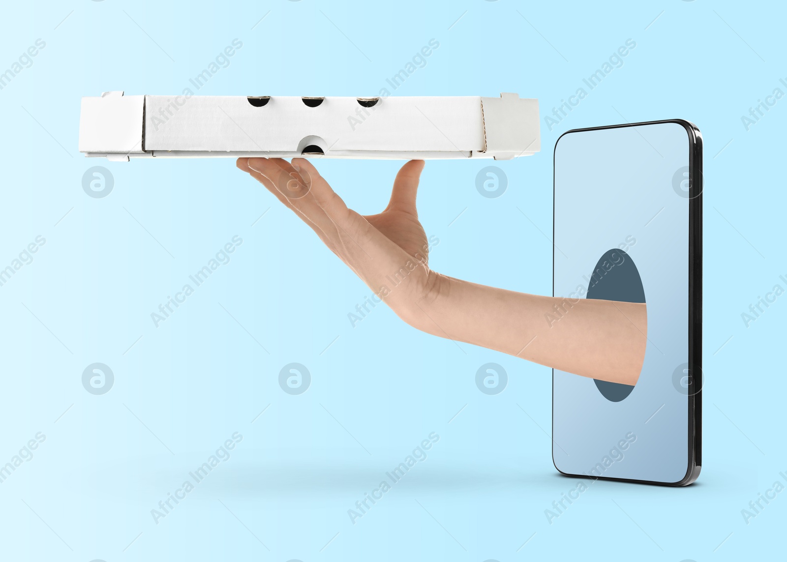 Image of Food ordering and delivery service. Woman's hand giving pizza box through mobile phone display, closeup. Light blue gradient background