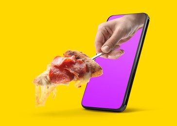Image of Food ordering and delivery service. Woman's hand giving slice of tasty pizza through mobile phone display, closeup. Orange background