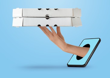 Image of Food ordering and delivery service. Woman's hand giving pizza boxes through mobile phone display, closeup. Light blue background