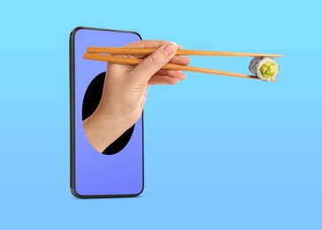 Image of Food ordering and delivery service. Woman's hand with sushi roll, sticking out of mobile phone display against blue gradient background, closeup