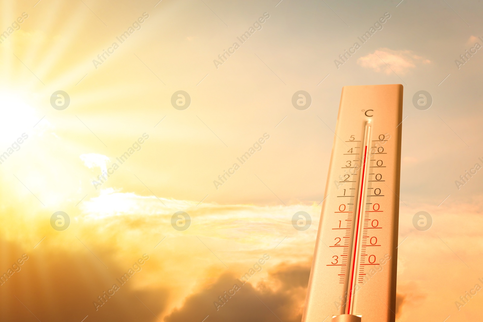 Extremely high temperature on thermometer against orange sky on sunny day. Severely hot summer weather Image of Extremely high temperature on thermometer against orange sky on sunny day. Severely hot summer weather