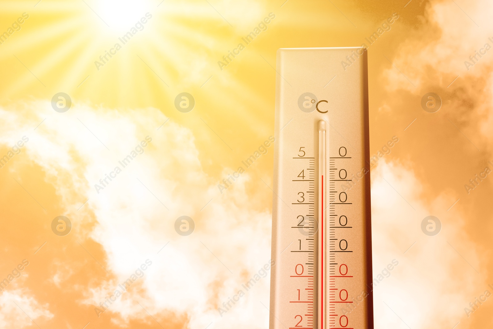 High temperature on thermometer against orange sky on sunny day. Hot summer weather Image of High temperature on thermometer against orange sky on sunny day. Hot summer weather