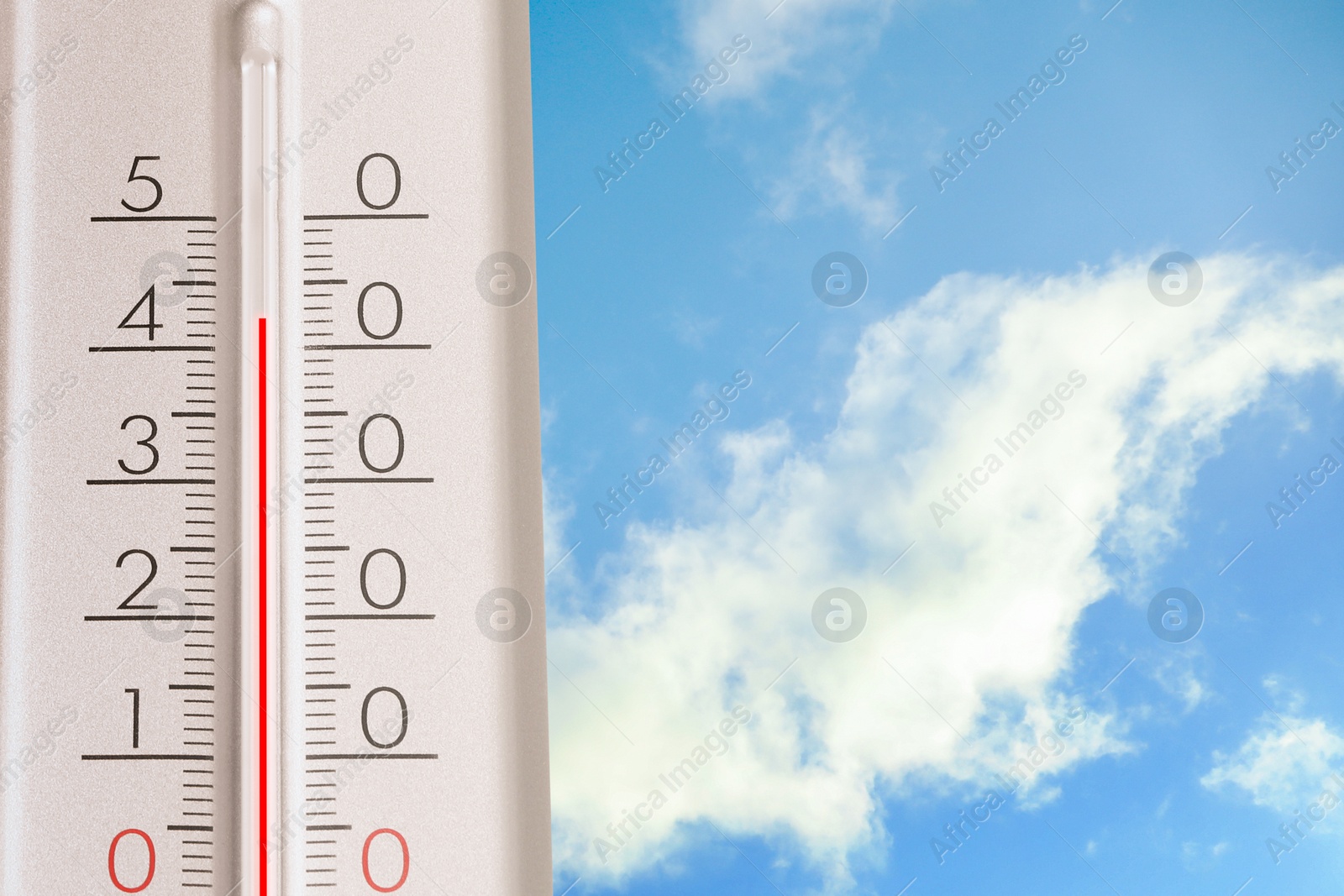 Image of High temperature on thermometer against blue sky on sunny day. Summer weather