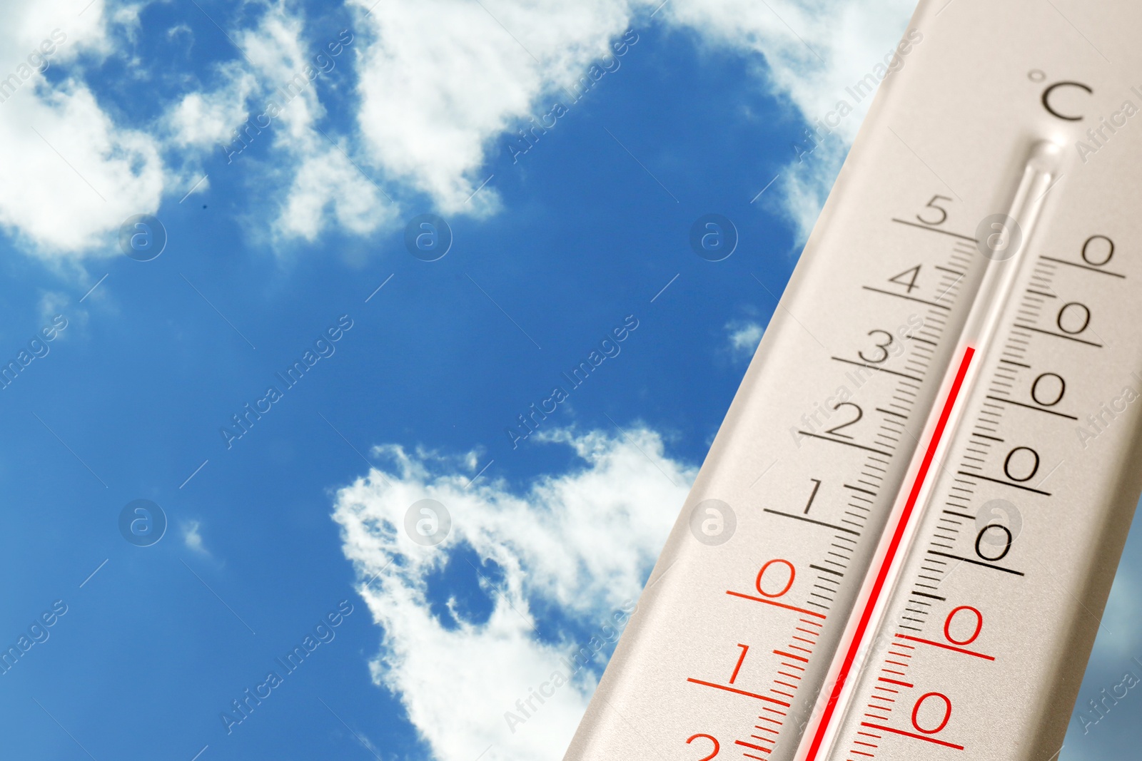 High temperature on thermometer against blue sky on sunny day. Summer weather Image of High temperature on thermometer against blue sky on sunny day. Summer weather