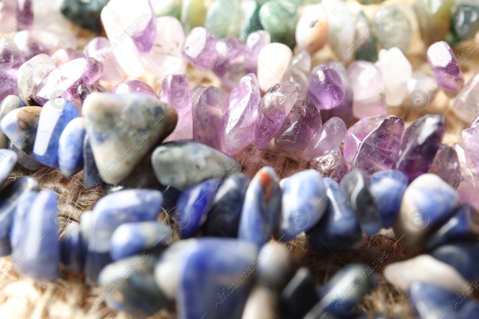 Many different healing stones on table, closeup Photo of Many different healing stones on table, closeup