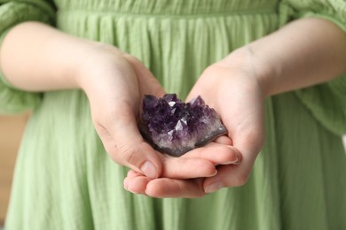 Photo of Woman with different beautiful healing stones, closeup