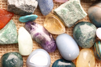 Photo of Different healing stones on table, top view