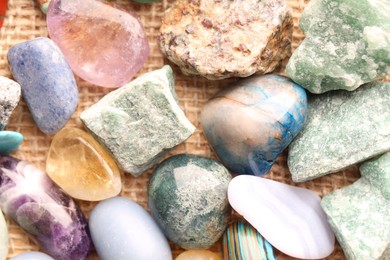 Photo of Different healing stones on table, top view