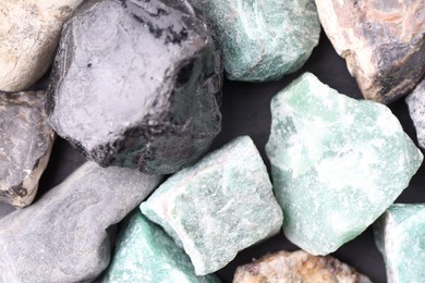 Photo of Different healing stones on table, top view