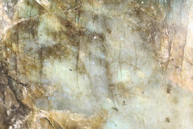 Photo of Healing stone. Beautiful labradorite as background, top view