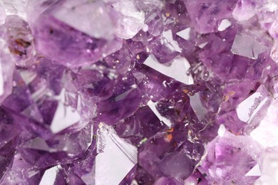 Photo of Healing stone. Beautiful amethyst as background, top view