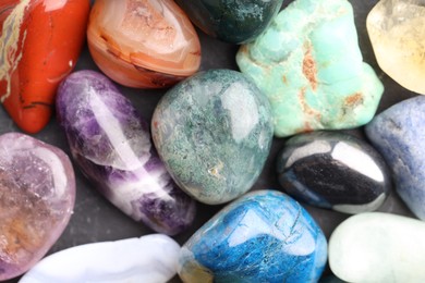 Photo of Different healing stones on table, top view