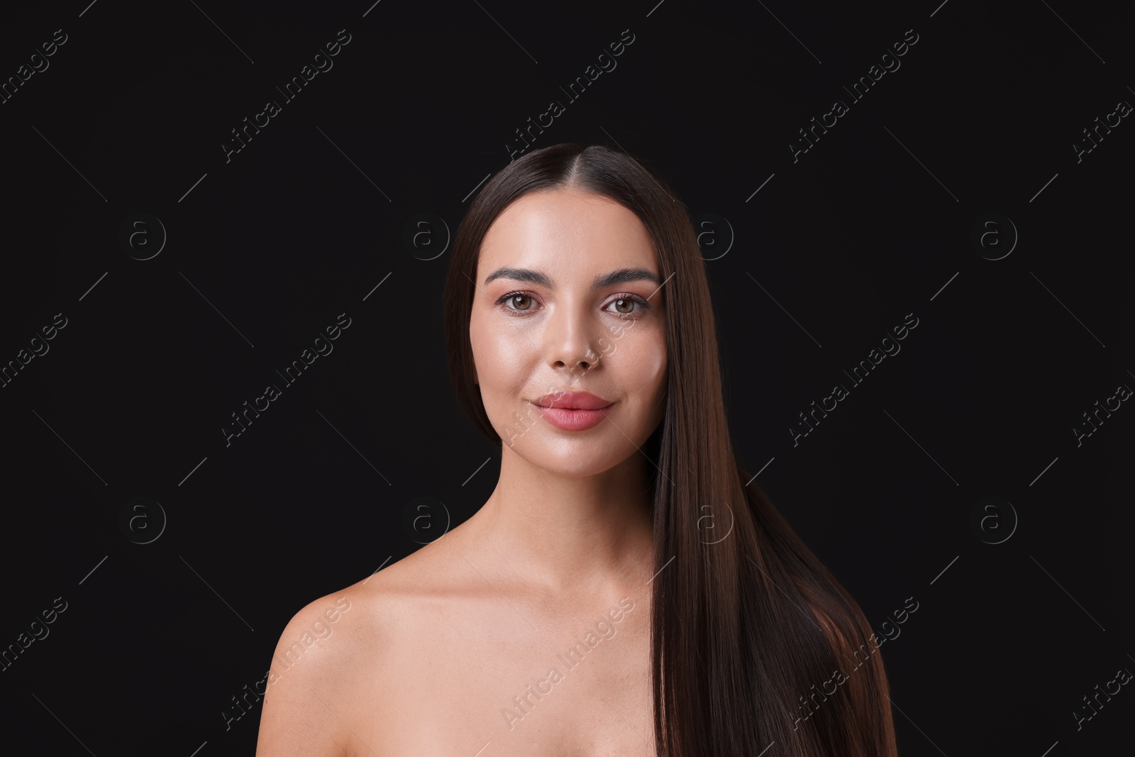 Woman with beautiful smooth hair after lamination procedure on black background Photo of Woman with beautiful smooth hair after lamination procedure on black background