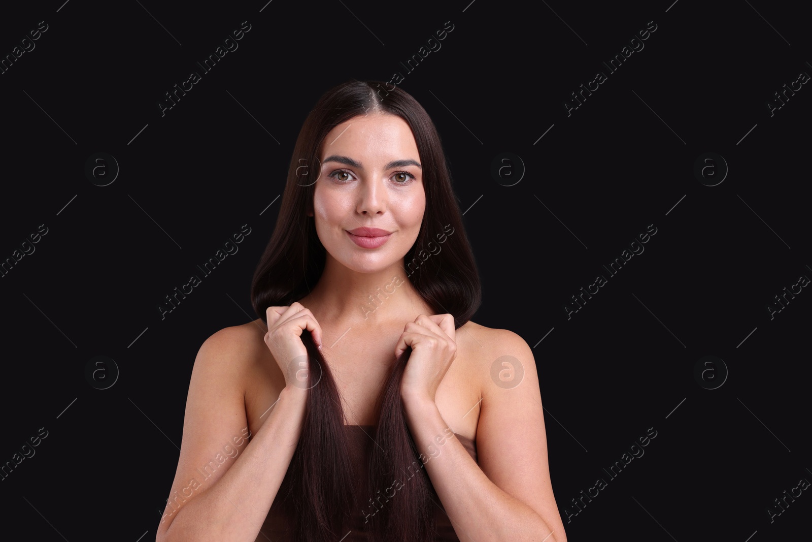 Photo of Woman with beautiful smooth hair after lamination procedure on black background, space for text