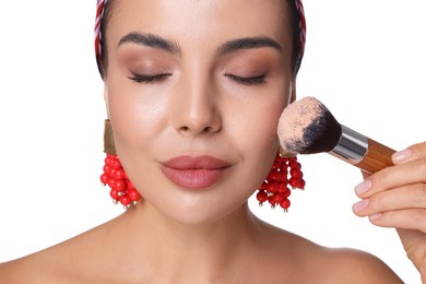 Photo of Beautiful woman with makeup brush on white background, closeup