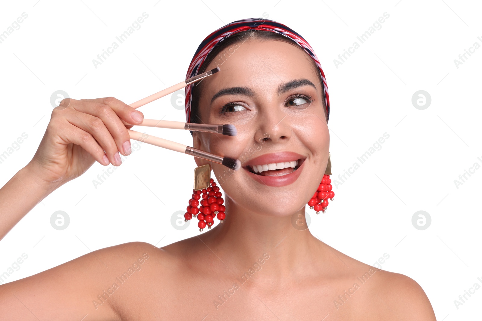 Beautiful woman with makeup brushes on white background Photo of Beautiful woman with makeup brushes on white background